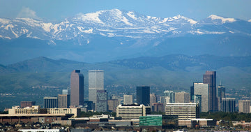 Skyline view of Denver, Colorado with the Rocky Mountains in the background